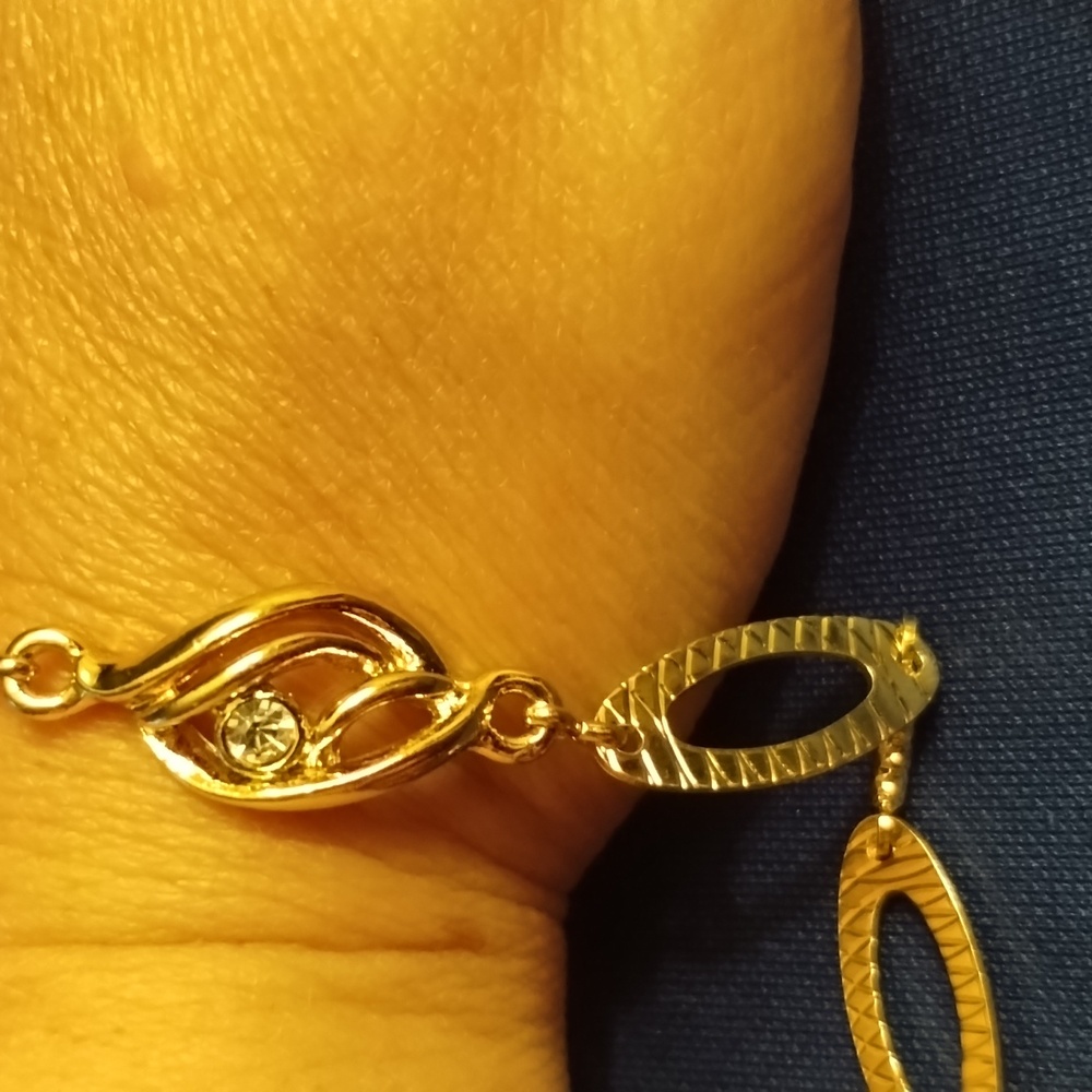 Gold colored bracelet with bling